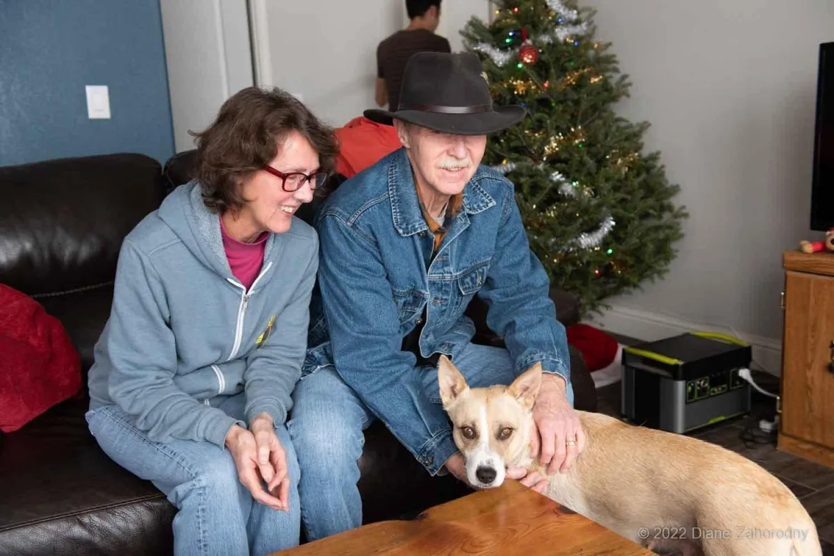 Older couple with blonde dog