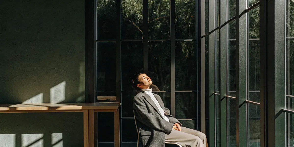A person relaxes in sunlight, calming the central nervous system naturally.