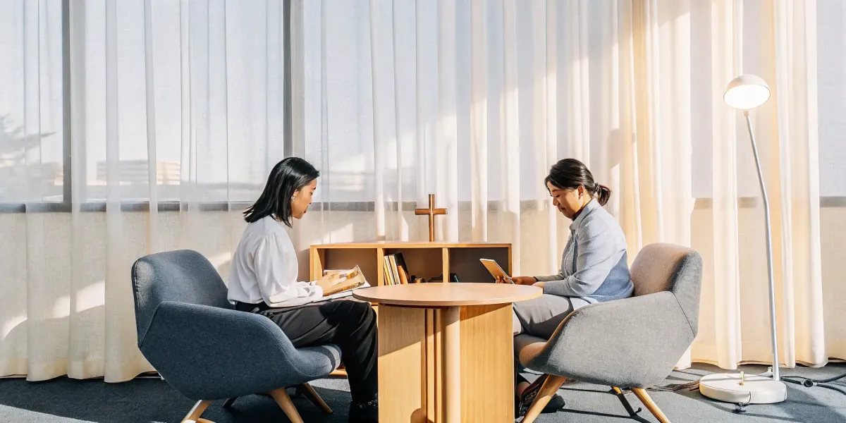 Two women talking during a free Christian strategy session for anxiety recovery.