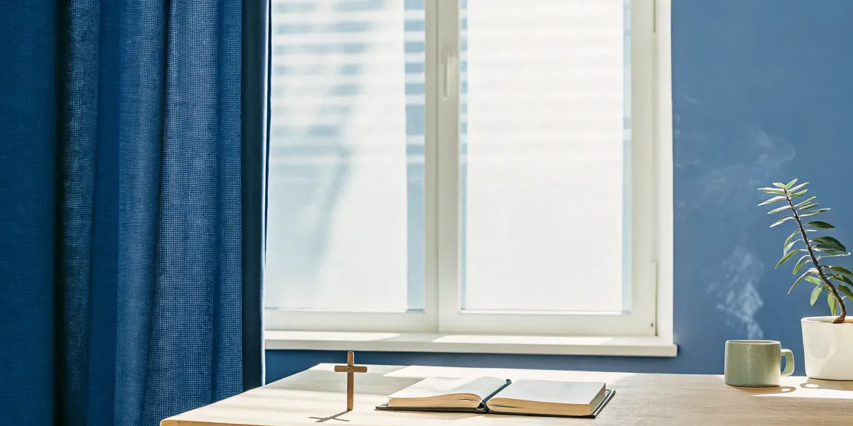 A Christian approach to healing anxiety with a Bible and cross on a desk in morning light.