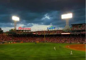 Fenway Park baseball stadium illuminated for exclusive Boston Summit evening event.
