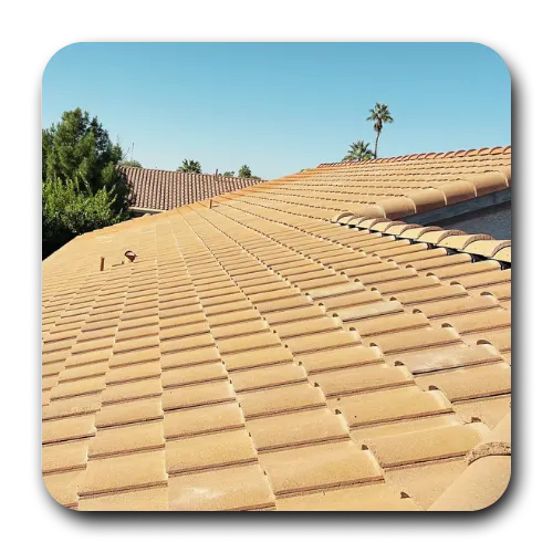 Professional tile roof repair in Scottsdale, AZ, featuring tan concrete S-tile roofing on a residential home.