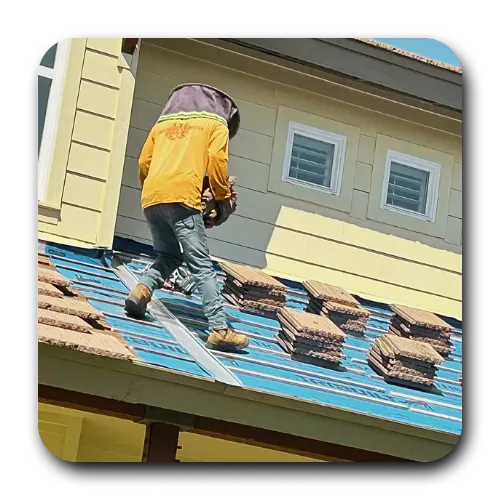 Scottsdale roofing crew installing asphalt shingles with high-quality underlayment on a multi-story home.