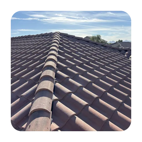 Professional tile roof repair in Scottsdale, AZ, featuring tan concrete S-tile roofing on a residential home.