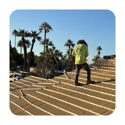 Expert local roofers installing new tile underlayment and stacking roof tiles for a full replacement in Scottsdale.