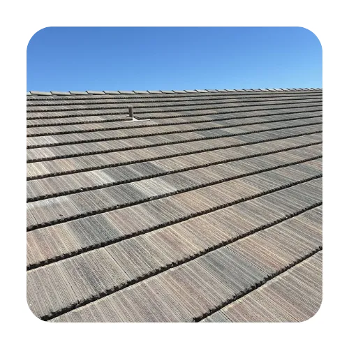 Newly finished tile roof replacement in Scottsdale showing clean ridge lines and desert-toned concrete tiles.