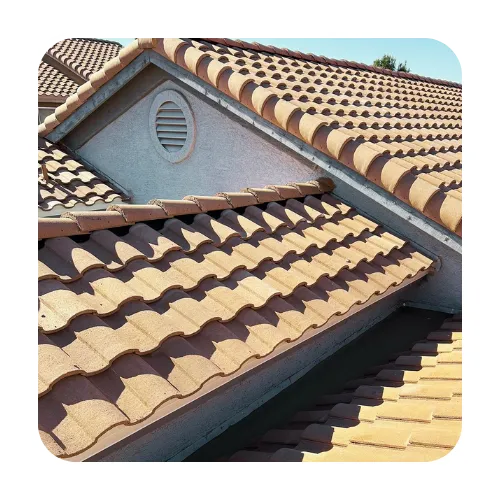 Close-up of tan S-tile roofing with professional flashing and valley work, typical of Santa Fe style homes in Apache Junction, AZ.