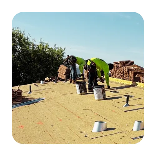 Roofing contractors installing high-quality waterproof underlayment for a full roof replacement in Apache Junction, Arizona.