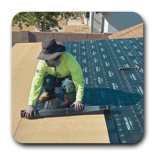 Professional roofer applying Polyglass self-adhered roofing membrane for a flat roof repair in San Tan Valley, AZ.