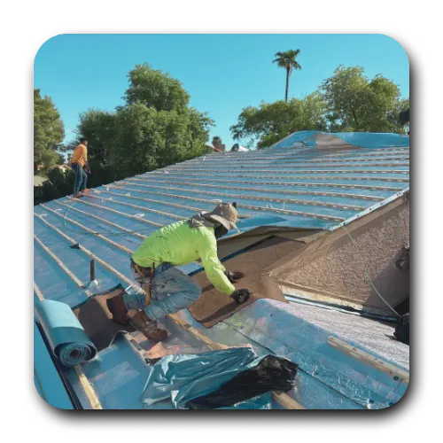 Roofing crew installing high-efficiency radiant barrier underlayment on a residential roof in Chandler to reduce cooling costs.