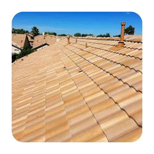 A clean, tan concrete tile roof with properly sealed vents, a specialty of phoenix residential roofers.