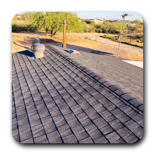 A completed shingle roof featuring a turbine vent, highlighting the reliable services of a roof contractor queen creek.