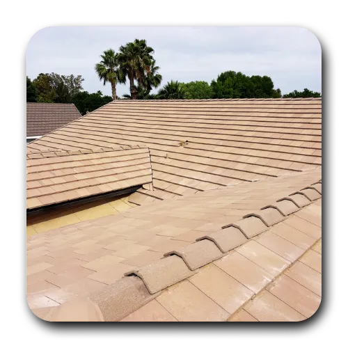 A finished tan flat-tile roof installation completed by a top-rated roofing contractor queen creek az for a residential property.