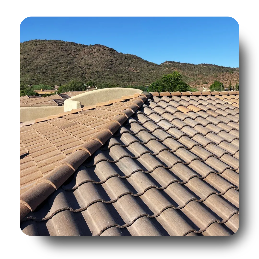 Residential roofing Phoenix AZ featuring tiled roof with desert mountain background