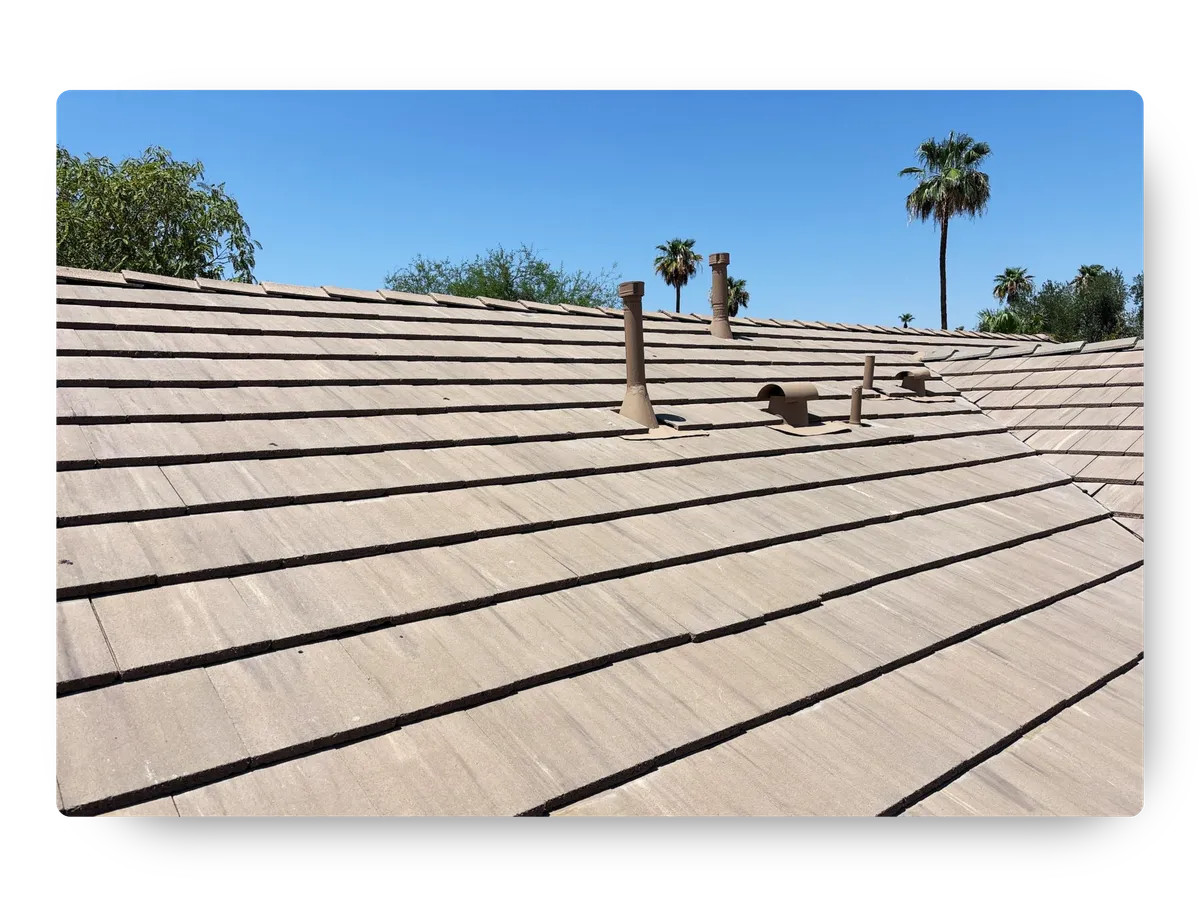 Completed flat clay tile roof with pipe boots installed by a professional roofing contractor queen creek