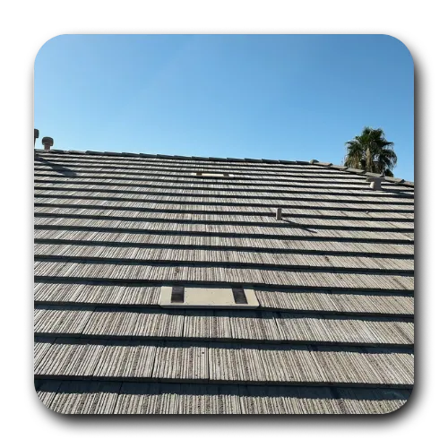 Grey shake-style tile roofing queen creek AZ on a residential home with roof vent pipes