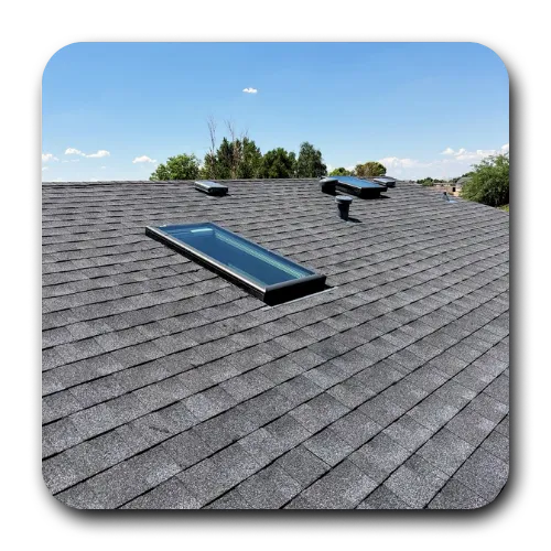 Dark asphalt shingle roof replacement with installed skylights completed by a professional roofing contractor in Gilbert.