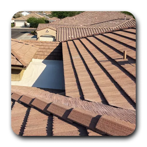 Multi-level tile roof combined with a flat foam roof section installed by a roofing company Mesa AZ.