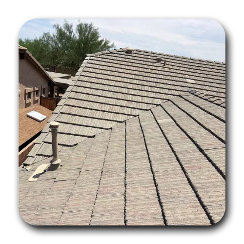 Multi-pitch flat tile roof structure after complete roof maintenance Scottsdale AZ and restoration.