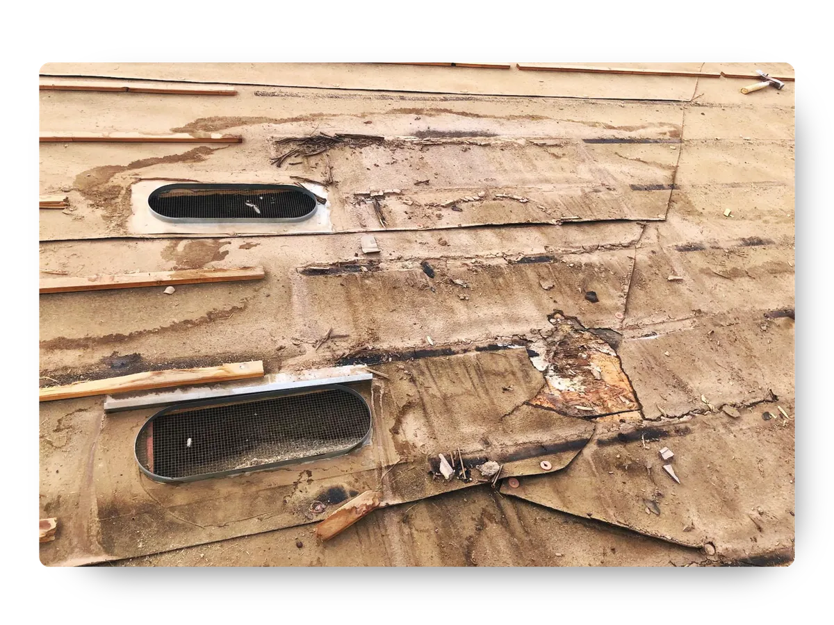 Damaged underlying roof structure uncovered during a free roof inspection by a local roofing contractor Scottsdale AZ.