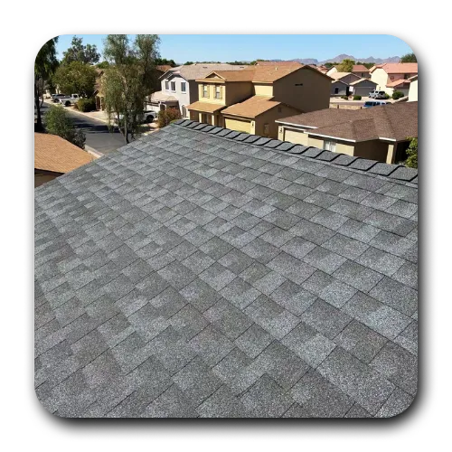 High-angle view of a completed grey architectural shingle roofing Chandler AZ project overlooking a neighborhood.