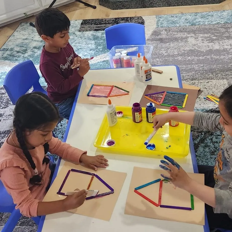 Girl follows directions during arts and crafts time.