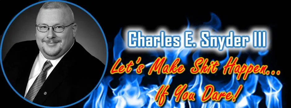 Charles E. Snyder III personal rand logo with blue flames, bld red/yellow text and drop shadow tagline: "Le's Make Shit Happen... If You Dare!"