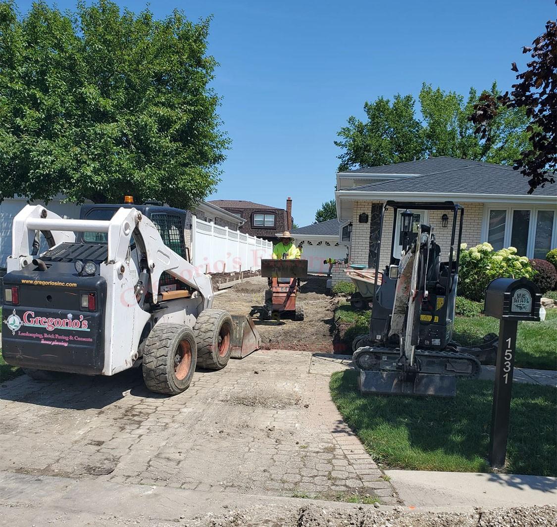 Gregorio's  team working on a driveway