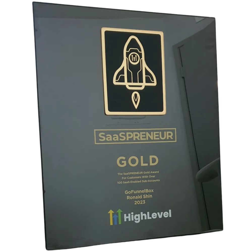 Photo of SaaSPreneur award plaque from Gohighlevel.