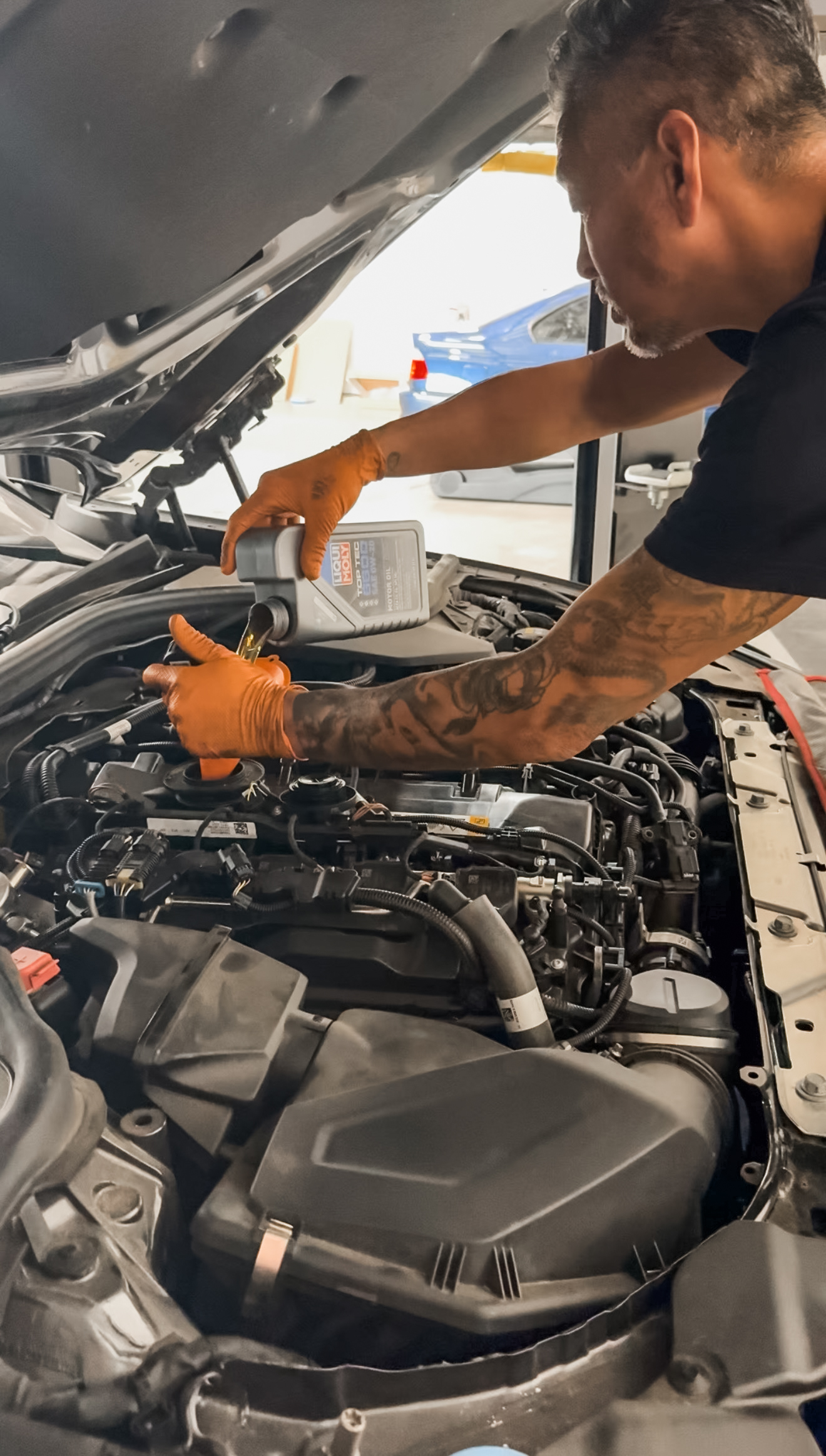 BMW undergoing a routine 5,000-mile oil change for engine longevity