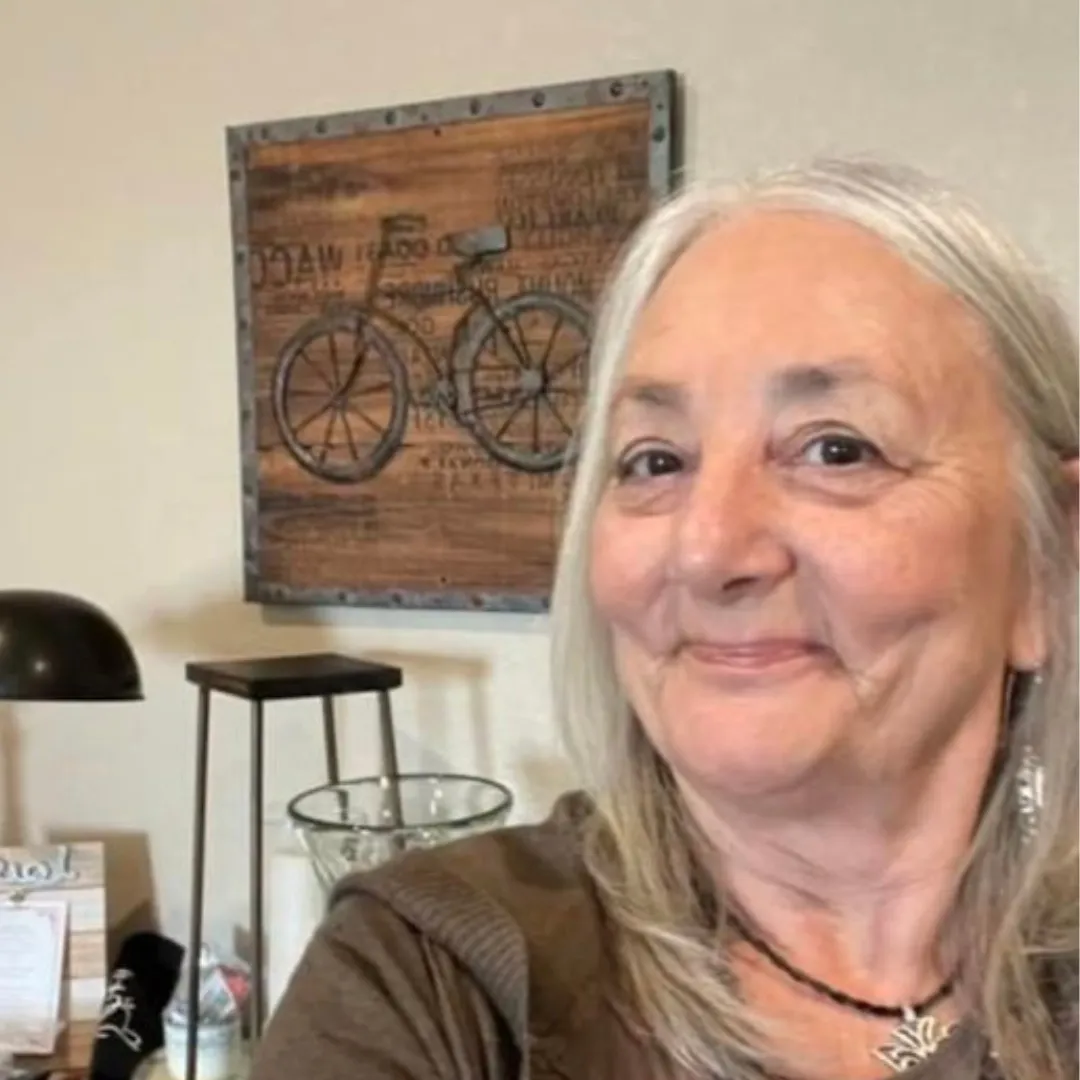Founder working at a desk in a bright office, candid photorealistic portrait