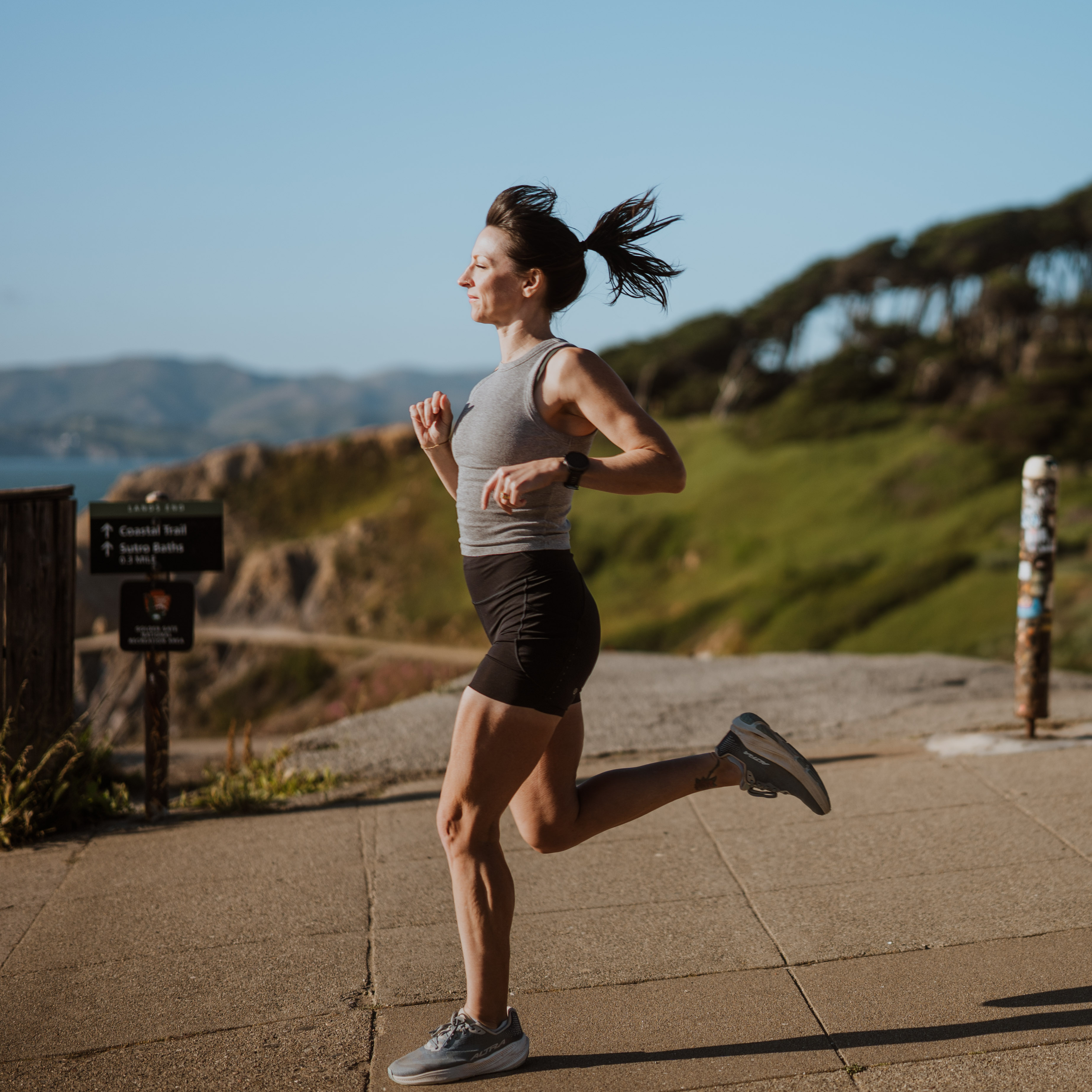 Tarah Venn running outdoors on a trail