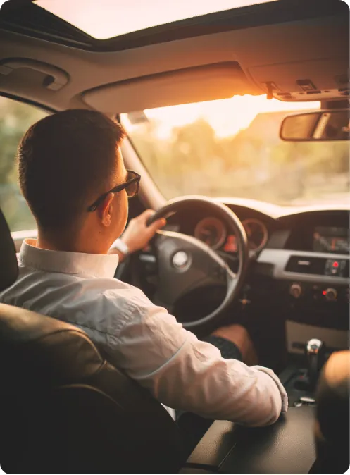 a man driving a rideshare car