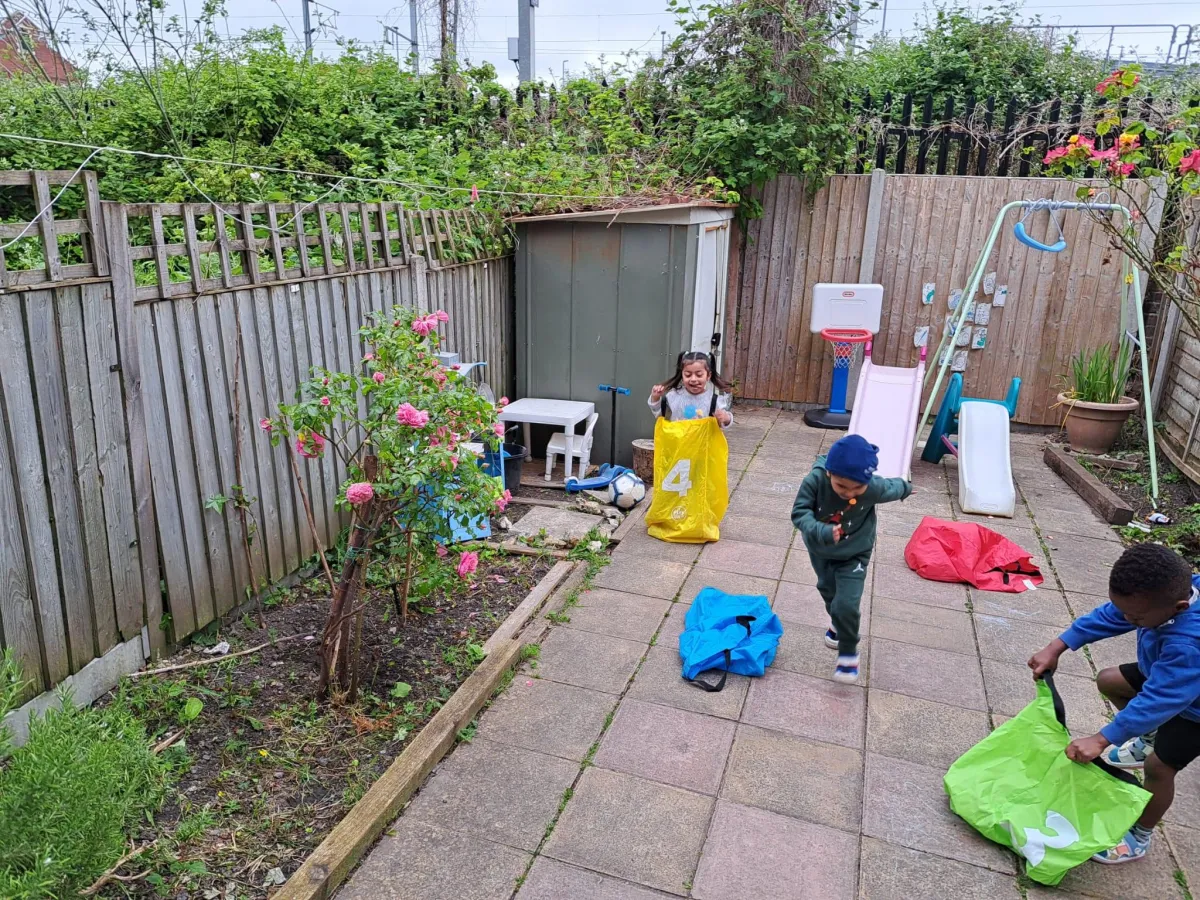 Children playing in the garden at Arise and Shine Childcare