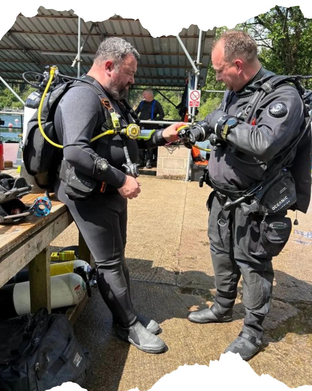 Two divers preparing to dive