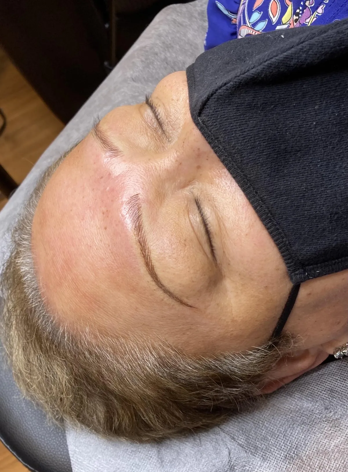 Thinly microbladed brows on older skin type. Light brown pigment.