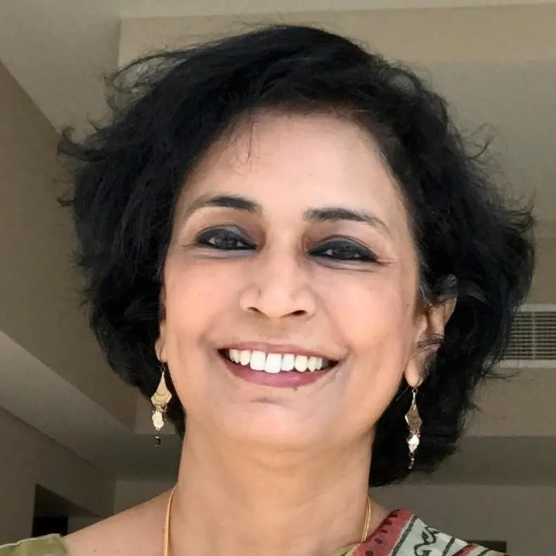 Professional head-and-shoulders portrait of an Indian woman in business clothing