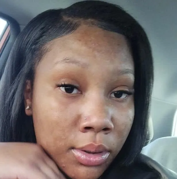 Black woman stylist with long braids, focused, salon background, 1:1 aspect ratio