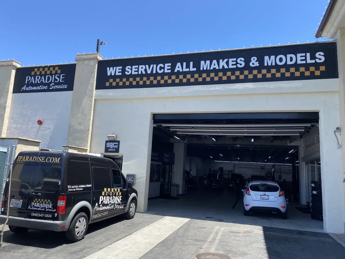 Paradise Automotive Service auto repair shop in San Juan Capistrano with a service van and garage entrance, offering expert car and truck maintenance. We serve all makes & models in South Orange County.