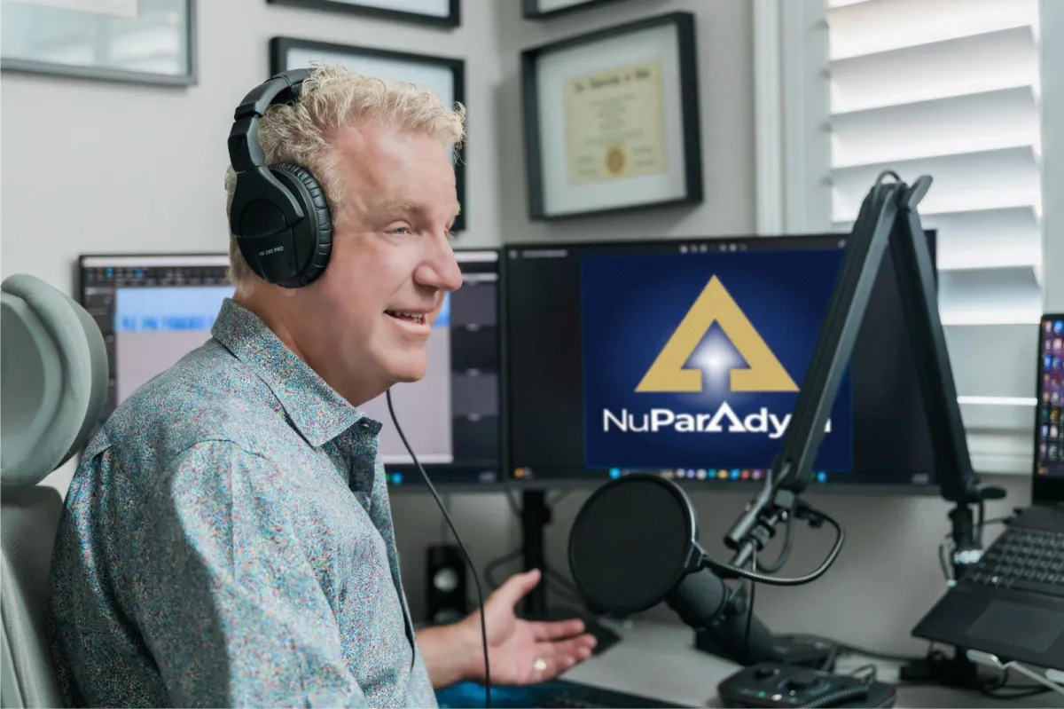 three person standing near wall inside building