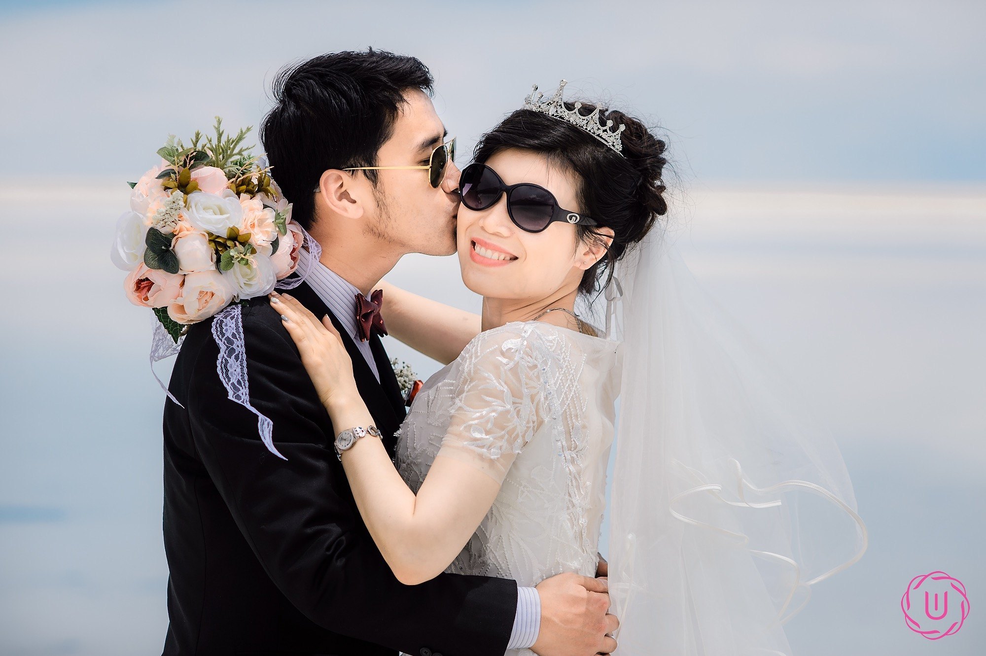 silhouette of 2 person standing on rocky ground during sunset