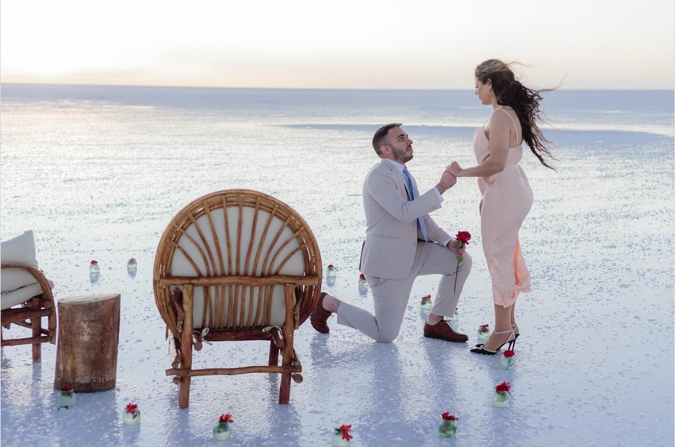 clear glass water filled goblet on top of table