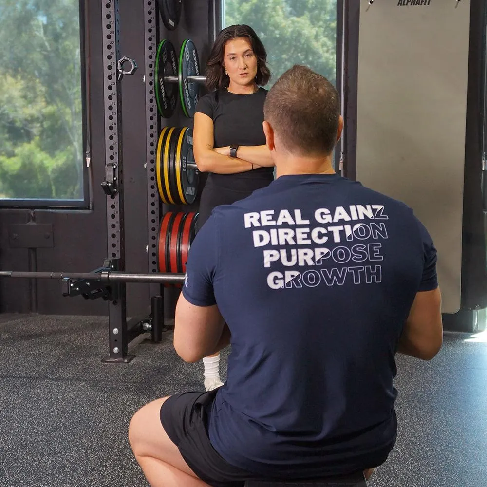 Personal trainer speaking with a client