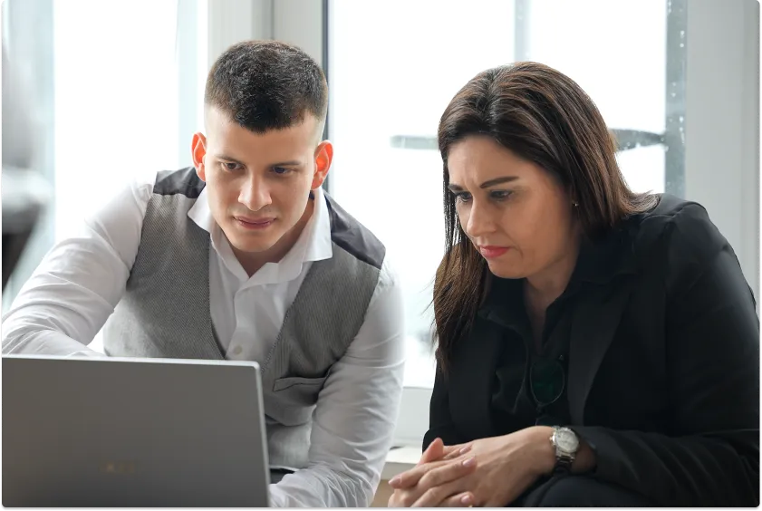 Oscar working with a client in the field