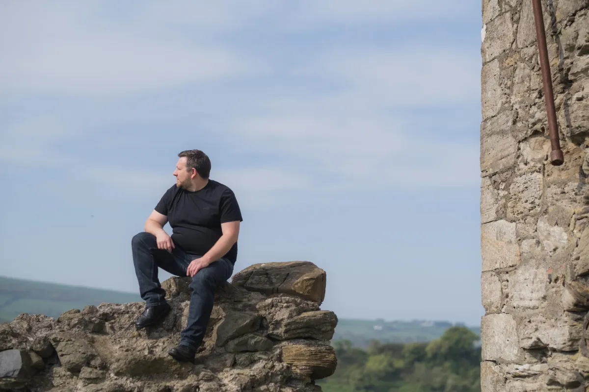 Environmental portrait of male brand and web designer, Ian Fergus, taken in Edinburgh  by Victoria Rose Photography