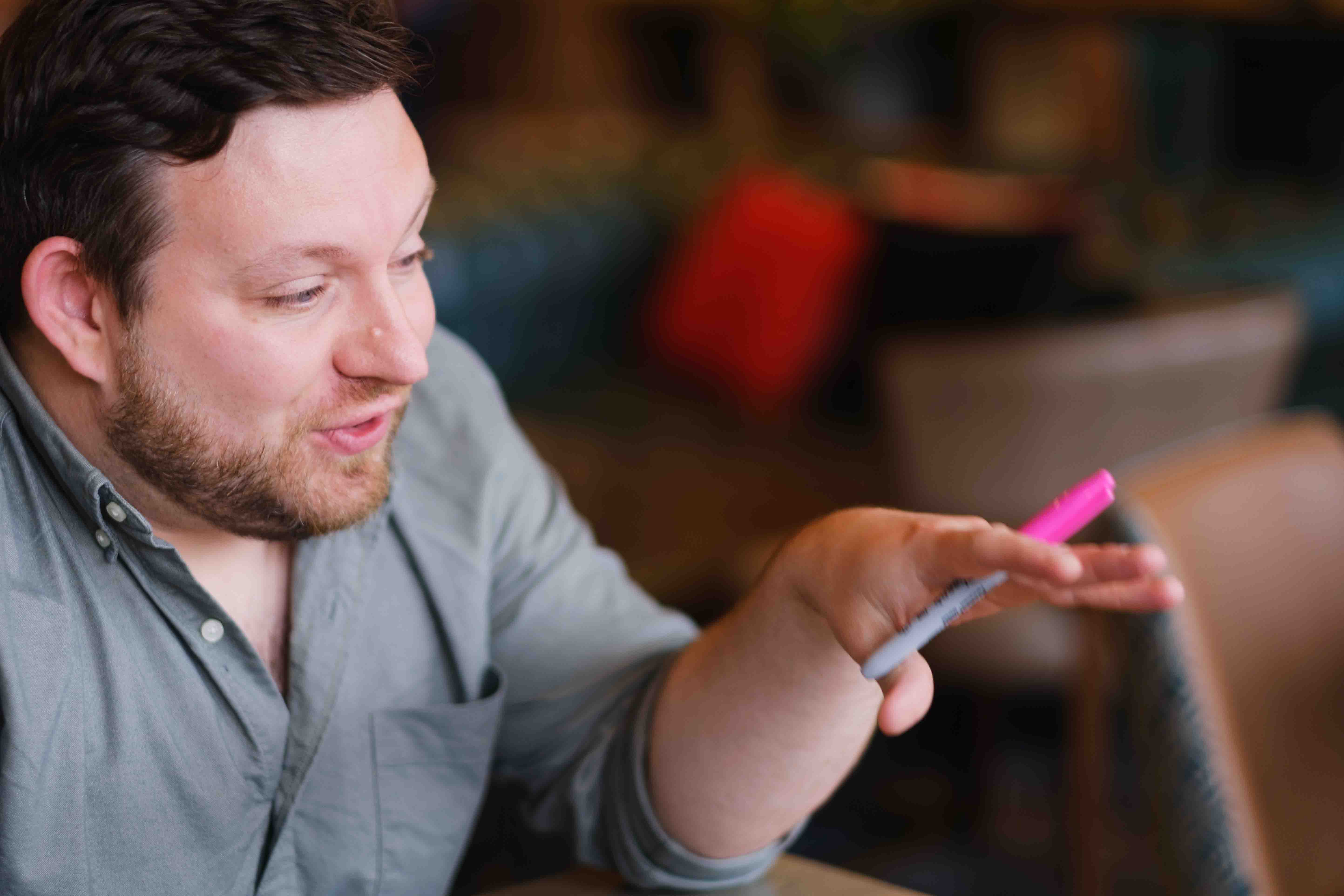 Indoor portrait of male brand and web designer, Ian Fergus, taken in Edinburgh cafe by Victoria Rose Photography