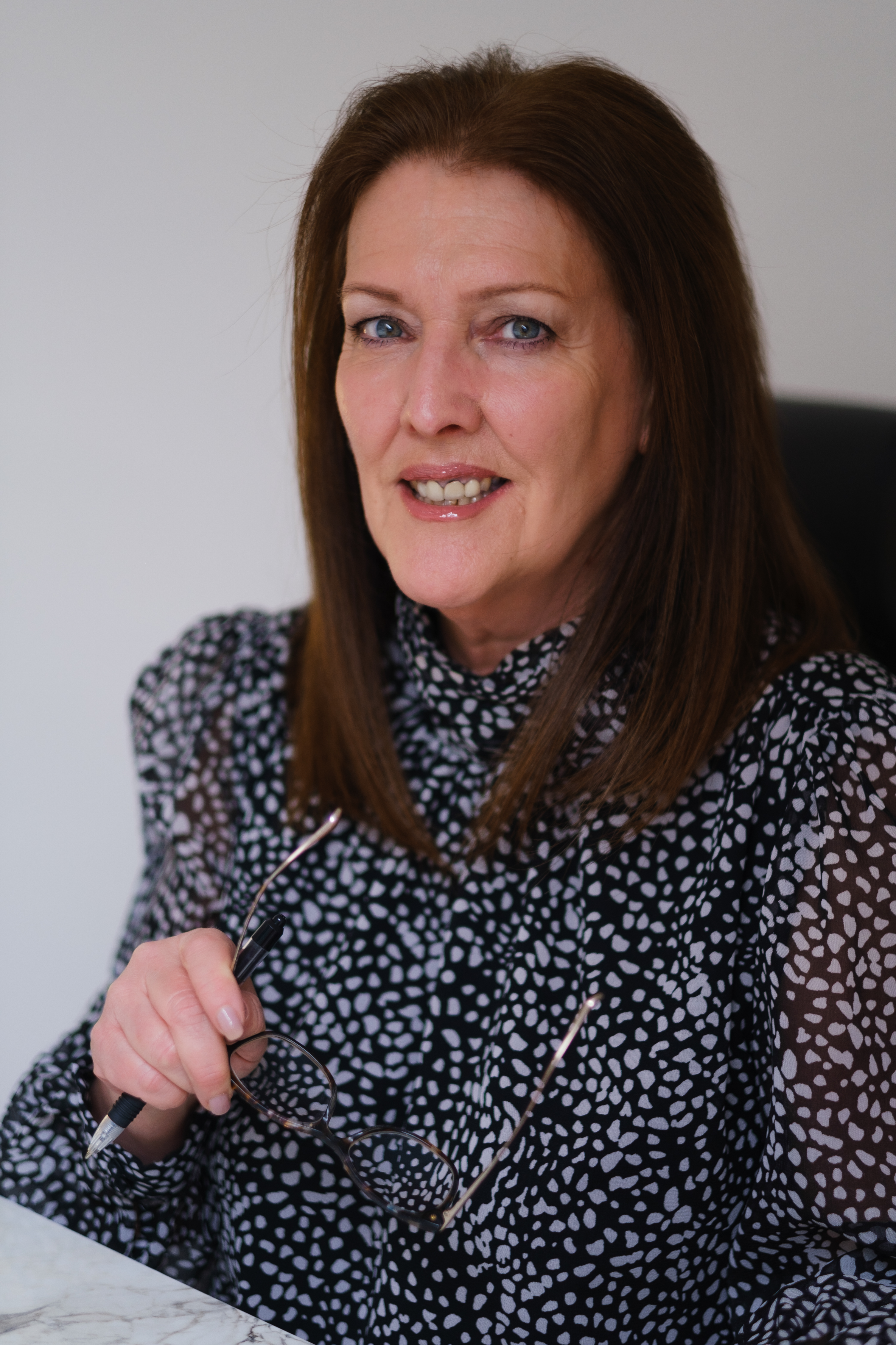 Indoor portrait of a female PR consultant photographed in Glasgow by Victoria Rose Photography