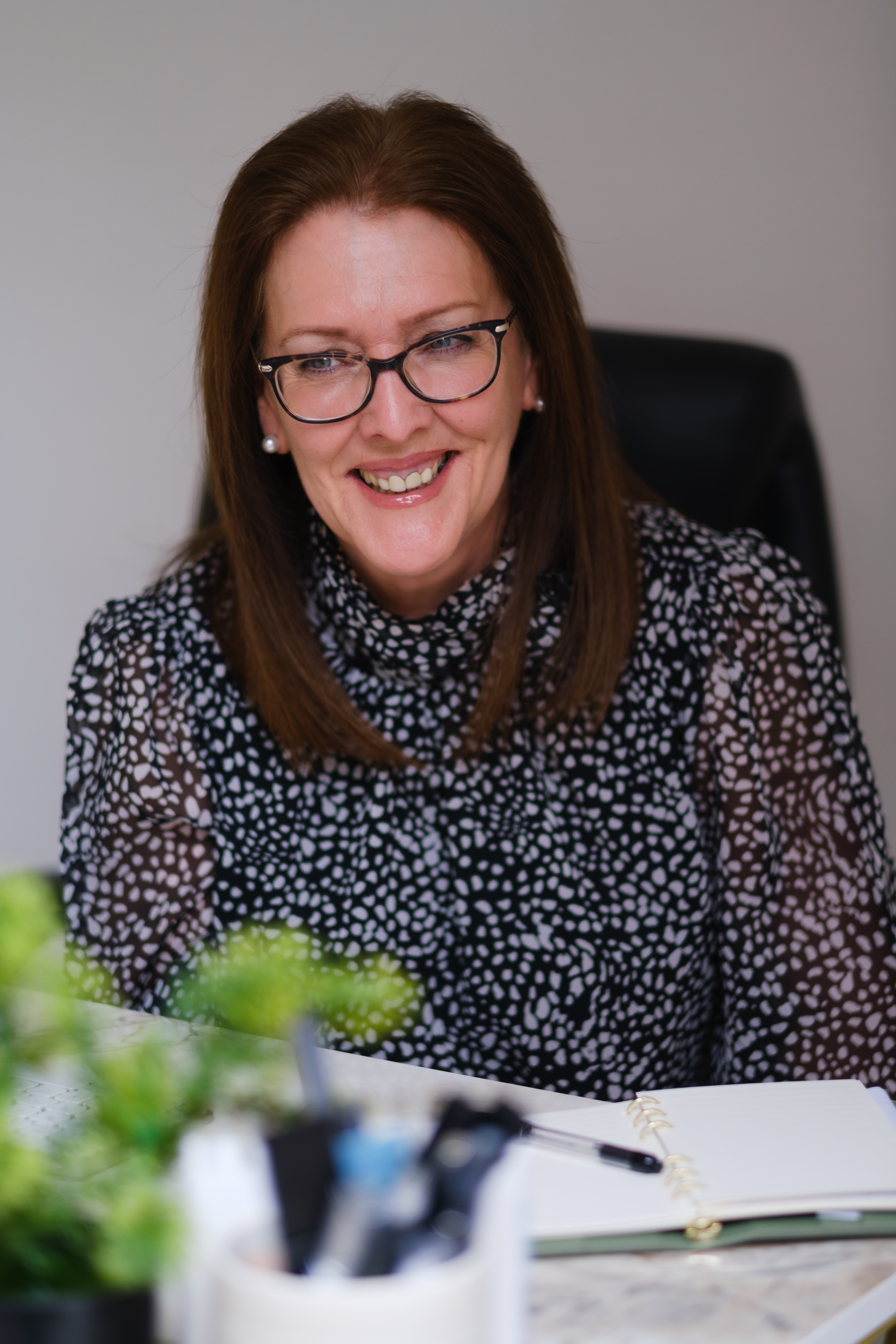 Indoor portrait of a female PR consultant photographed in Glasgow by Victoria Rose Photography