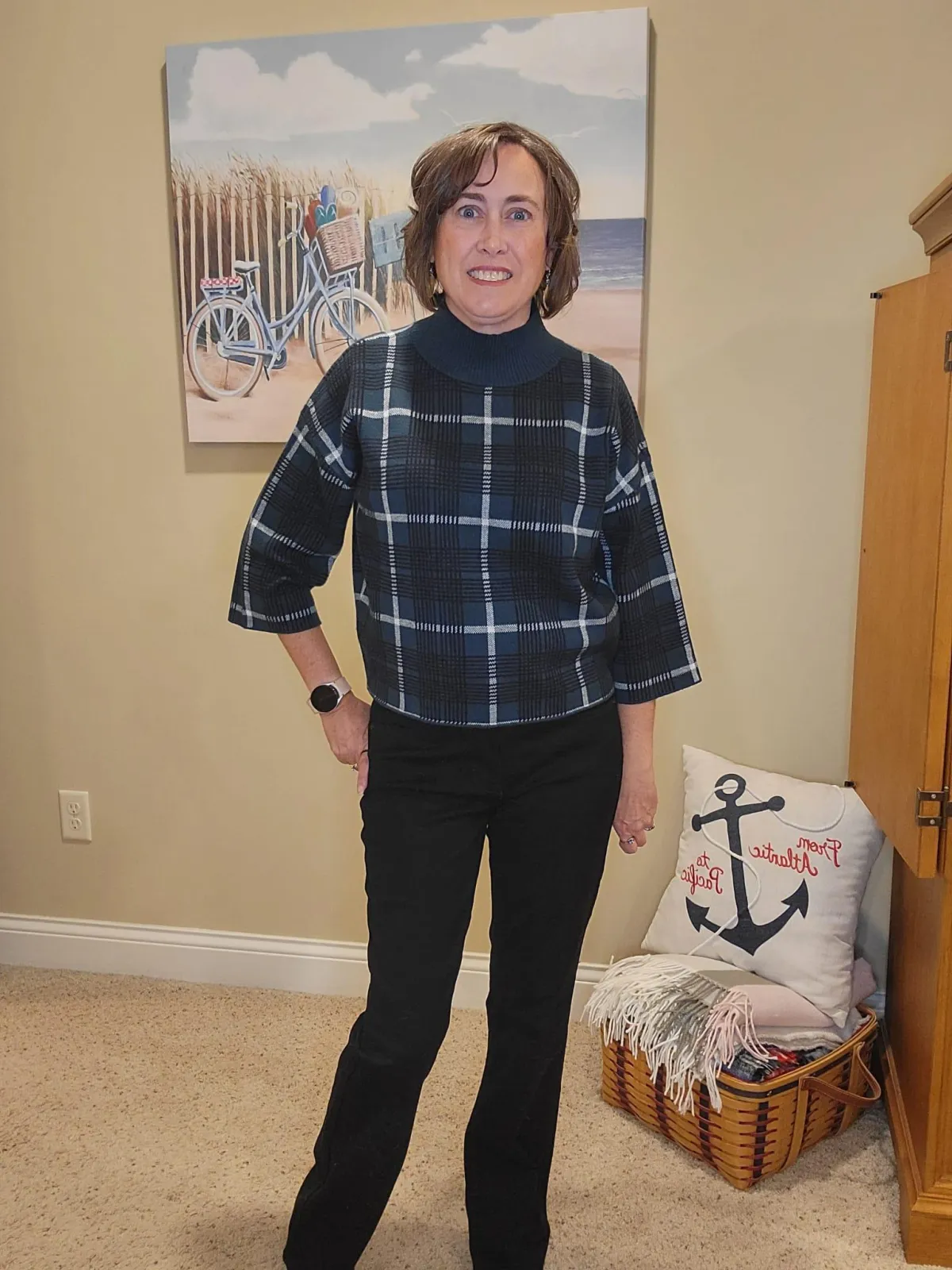 Jenn Whitacre wearing an Ann Taylor green and black plaid sweater with black jeans and black boots, creating a classic and polished fall outfit.