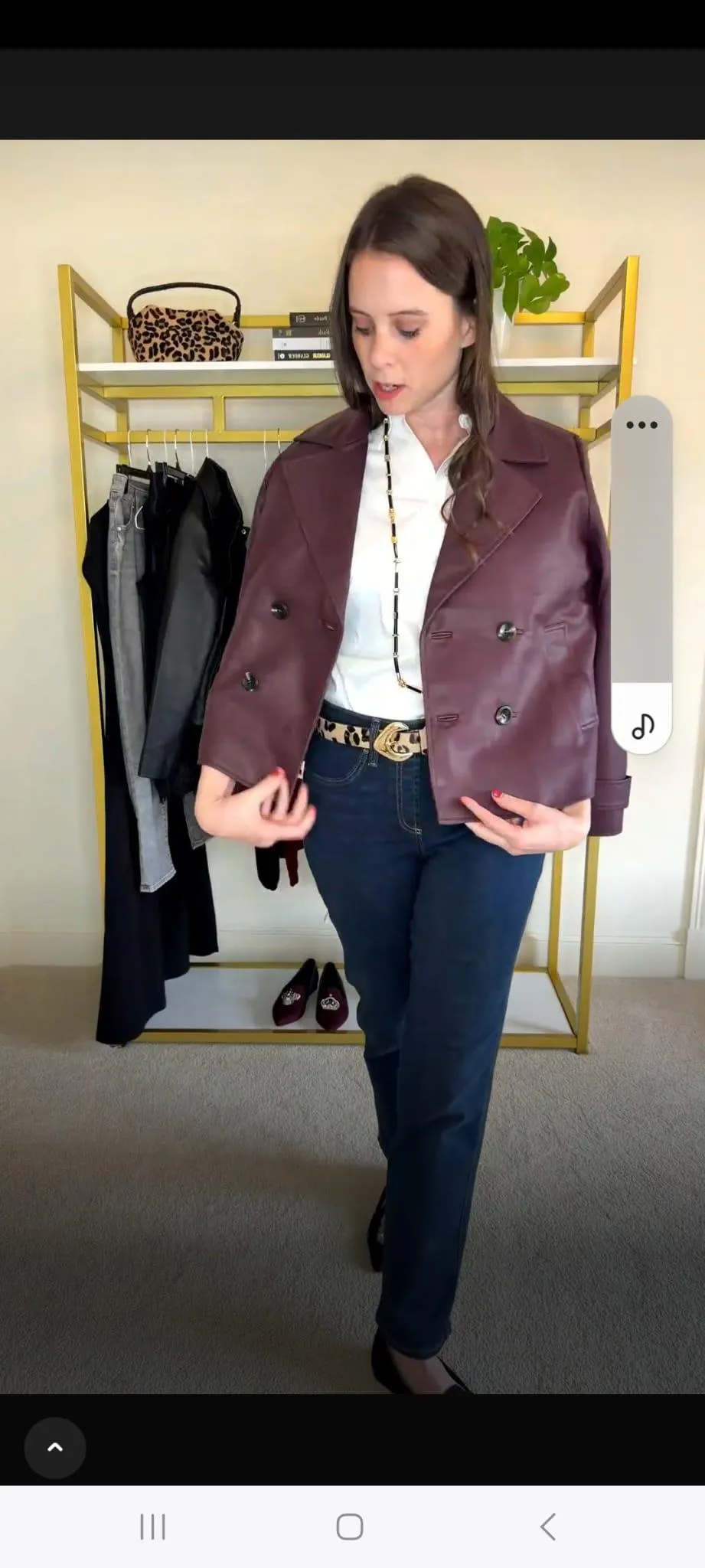 Jenn Whitacre wearing a WHBM burgundy top with matching coated denim jeans, silver long necklace and earrings, and burgundy Croft & Barrow flats — a polished monochrome fall outfit.